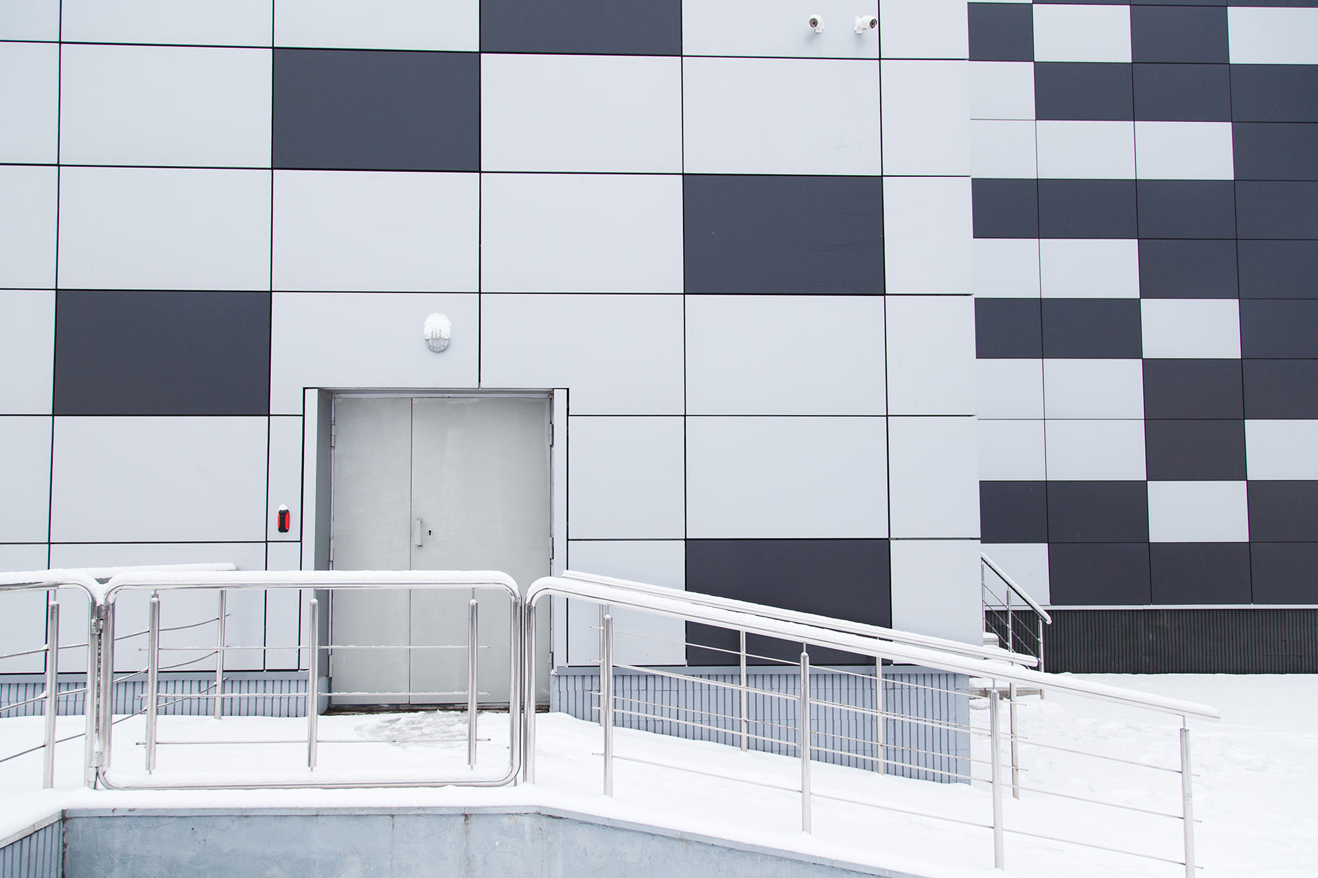 industrial-warehouse-modern-facade-with-door-and-s-2021-08-26-17-11-06-utc.jpg